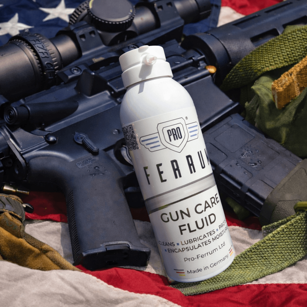 A can of Pro Ferrum next to a AR15 rifle and US flag